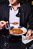 Man eats Zuppa di Verdure