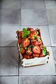 Cardboard box with fresh strawberries