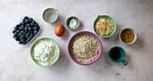 Ingredients for cream cheese sheet cake with blueberries and almonds