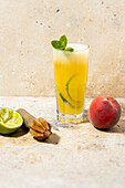 Peach rum drink with lime