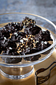 Dark chocolate almond slivers with roasted sesame seeds and sea salt