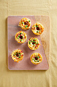 Spaghetti donuts with ham and peas