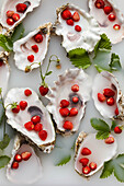 Oyster shells filled with milk and wild strawberries