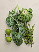 Fresh local produce from the market. Top view various green ingredients for cooking healthy vegetarian meal
