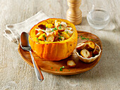 Savoy cabbage pumpkin stew with shell pasta, pretzel bread and mountain cheese