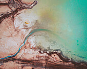 Aerial view of an abstract blue and turquoise clay lake, Art-sur-Meurthe, France.