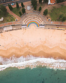 Aerial view of Coogee Beach with beautiful sandy shore and ocean waves, Coogee, Australia.