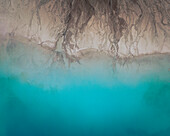 Aerial view of an abstract blue and turquoise clay lake, Art-sur-Meurthe, France.