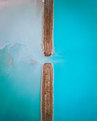 Aerial view of an abstract blue and turquoise clay lake, Art-sur-Meurthe, France.