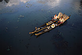 Aerial view of Fishermen with bamboo fishing baskets fishing in backwater, Kuttanad, Kerala, India