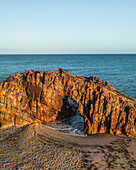 Aerial view of a natural arch along the coast in Jericoacoara, State of Ceara, Brazil.