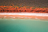 Aerial view of beautiful Bottle Bay with turquoise water, sandy beach, and rugged cliffs, Denham, Australia.