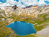 Aerial view of Ice Lake with mountain range in background in Ice Lake Basin National Forest, Silverton, Colorado, United States of America.