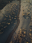 Aerial view of a countryside path covered with ashes from Cumbre Vieja Volcano in La Palma island, Canary Islands, Spain.