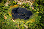 Aerial view of serene lake, lush forest, and tranquil pond at Fairwood Island, Pointe au Baril, Ontario, Canada.