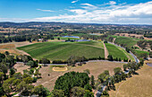 Aerial view of lush vineyards and rolling hills in the Adelaide Hills wine region, Balhanna, Australia.
