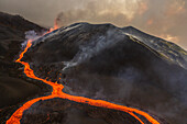 Aerial view of Cumbre Vieja volcano during an eruption with magma and lava in La Palma island, Canary Islands, Spain.