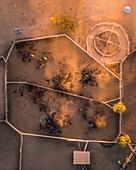 Aerial view of cattle yards at sunset in the dry outback, Emerald, Queensland, Australia.