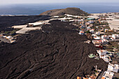 Aerial view of a residential area covered with ashes from Cumbre Vieja Volcano in La Palma island, Canary Islands, Spain.