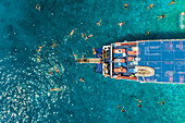 Aerial view of people swimming and diving off ferry, Ithaki island, Greece.