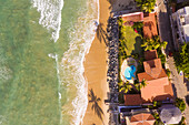 Aerial view of houses on the shore of the beach, Taiba, São Gonçalo do Amarante, Ceará, Brazil