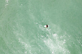Aerial view of a surfer in Taiba, São Gonçalo do Amarante, Ceará, Brazil