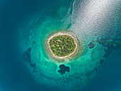 Aerial view of small islet of Itea called Agios Athanasios in Greece