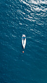Aerial view of a sailing boat moored in mediterranean sea
