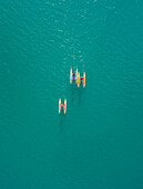 Aerial view of group of people having fun while riding water bikes at lake Plastira in Greece