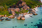 Aerial view of people relaxing on the beach with granite formation at Anse Source d'Argent beach, La Digue and Inner Islands, Seychelles.