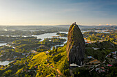 Aerial view of Piedra del Penol touristic attraction, a huge rock with steps to the top near Guatapé town, Antioquia, Colombia.