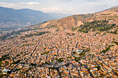 Aerial view of north residential district of Medellin, a dense population favela in town, Antioquia, Colombia.