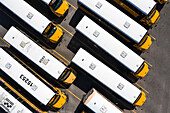 Palm Bay, USA - 27 March 2021: Aerial view of school buses parked in a parking lot, Palm Bay, Florida, United States.