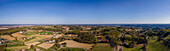 Aerial drone panoramic view of the countryside under an almost clear sky on the border with Styria and Burgenland, Austria.
