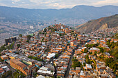 Aerial view of north residential district of Medellin, a dense population favela in town, Antioquia, Colombia.