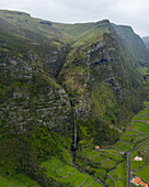Aerial view of Cascata do Poco do Bacalhau, a beautiful waterfall in Faja Grande, Azores islands, Portugal.