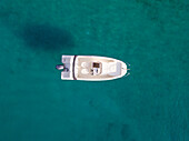 Aerial view of single speed boat floating over transparent water, Croatia.