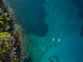 Aerial view of two persons practicing stand up paddle near Mali Lošinj, Croatia.