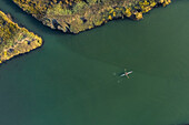Aerial view of a man doing sport in a Kayak in estuary of river Vouga, in Ria de Aveiro, Bioria, Salreu, Estarrega, Aveiro, Portugal