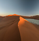 Aerial view of Sossusvlei and Deadvlei with sand dunes and persons, Hardap, Namibia.