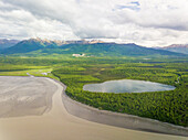 Aerial view of water reservatory near muddy shore, Kachemak bay, Alaska.