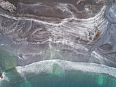 Aerial view of abstract pattern created by a red sand beach, Faroe island.