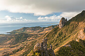 Aerial view of a person on top of Le Chat y La Souris mountain or Mount Villars, in the Bambous Range near Grand Sable, Flacq, Mauritius.