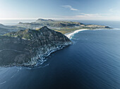Aerial view of Chapman Peak with Noordhoek Beach along the coastline along the Hout Bay, Cape Peninsula National Park, Cape Town, Western Cape, South Africa.