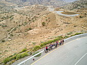 ETHIOPIA - February 14 2017 : Aerial view of friends waving on the side of a road in Ethiopia.