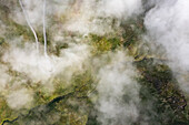 Aerial view of mountain peak with low clouds, Unalaska island, Alaska, United States.