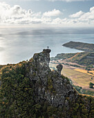 Aerial view of a person on top of Le Chat y La Souris mountain or Mount Villars, in the Bambous Range near Grand Sable, Flacq, Mauritius.