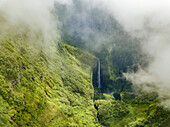 Aerial view of misty Voile de la Mariee waterfall, Reunion island.