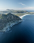 Aerial view of Chapman Peak with Noordhoek Beach along the coastline along the Hout Bay, Cape Peninsula National Park, Cape Town, Western Cape, South Africa.