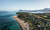 Aerial view of Le Morne Beach, a beautiful white sand beach and the Rivière Noire bay in background, Rivière Noire, Mauritius.